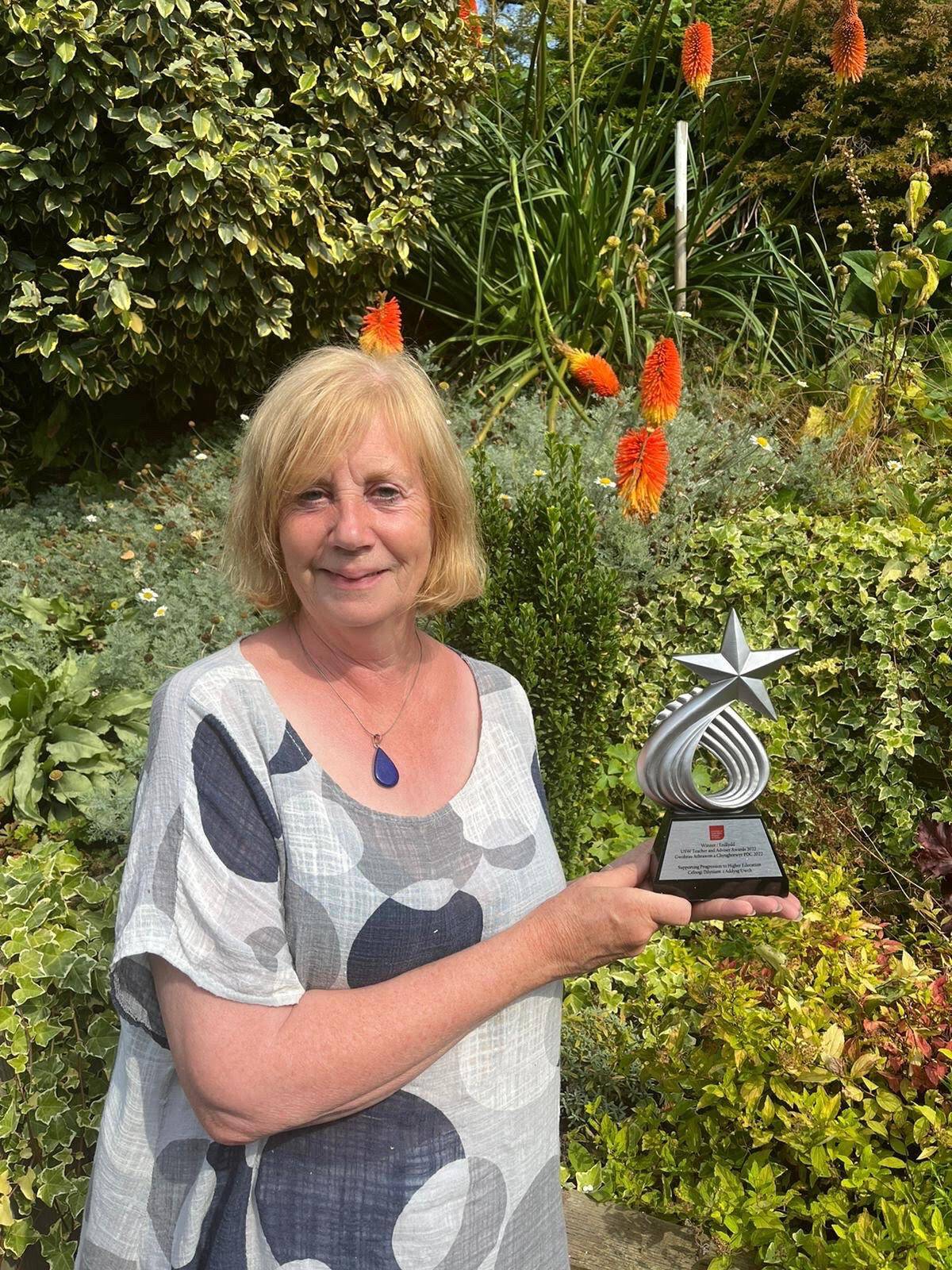 Tutor Wendy receiving her award.