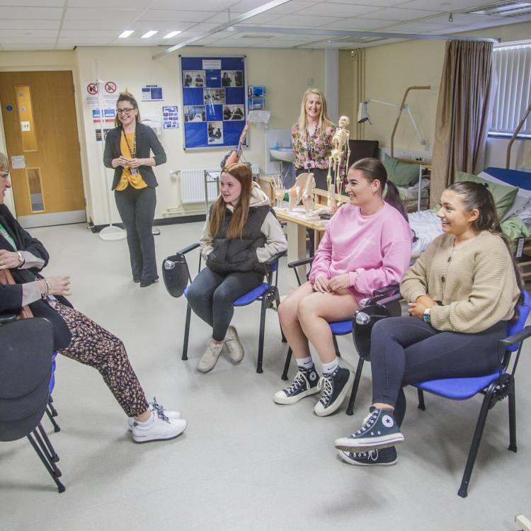 Welsh Language Commissioner Efa Gruffudd Jones talking to students at Coleg Llandrillo