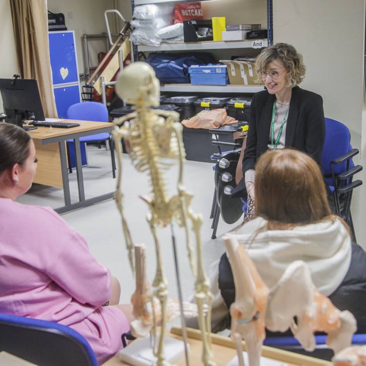 Welsh Language Commissioner Efa Gruffudd Jones talking to students at Coleg Llandrillo