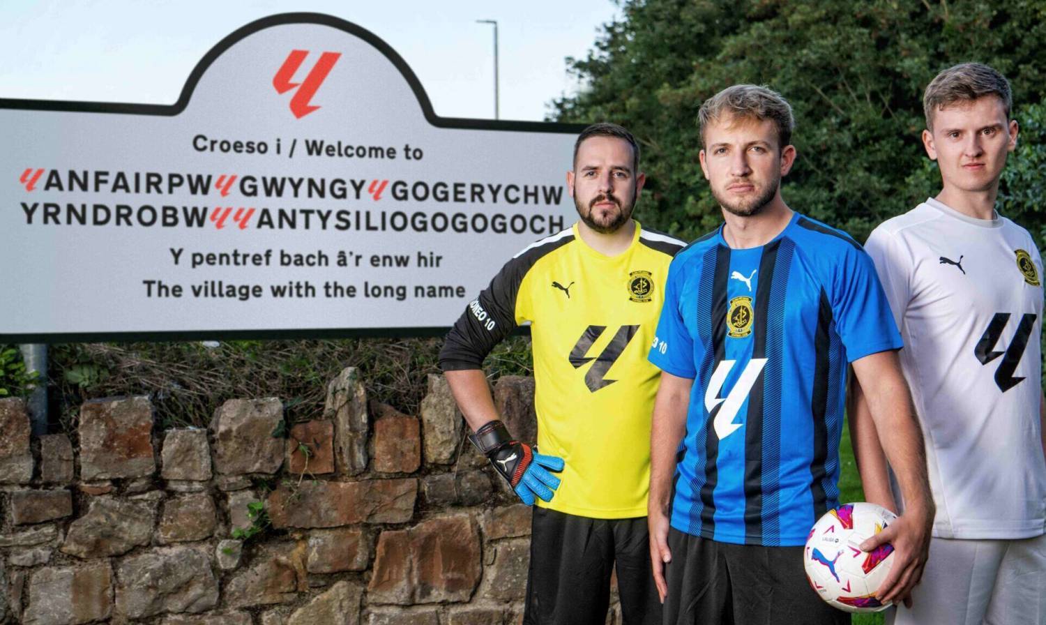 Llanfairpwll players with the sign presented to the village featuring the La Liga logo