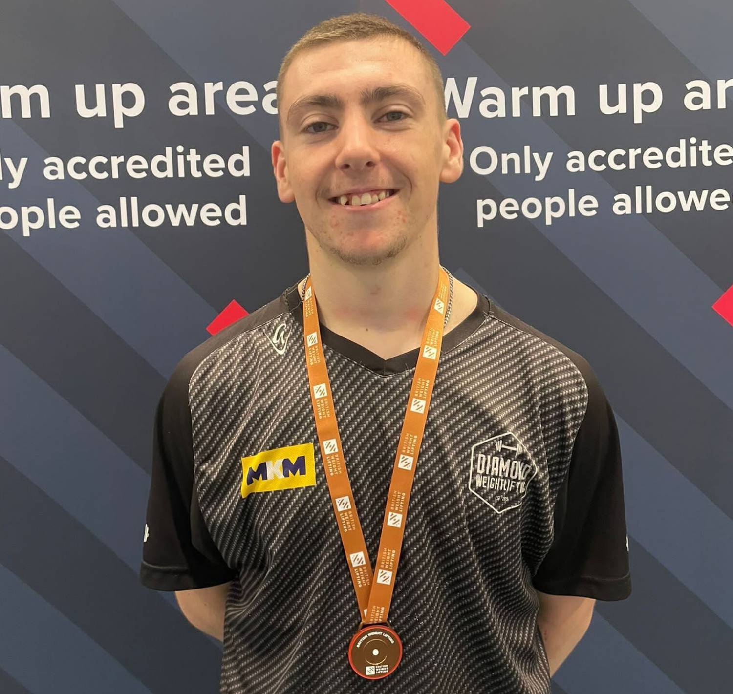 Coleg Llandrillo student Seamus Thomas with his bronze medal at the British Weightlifting Age Group Championships