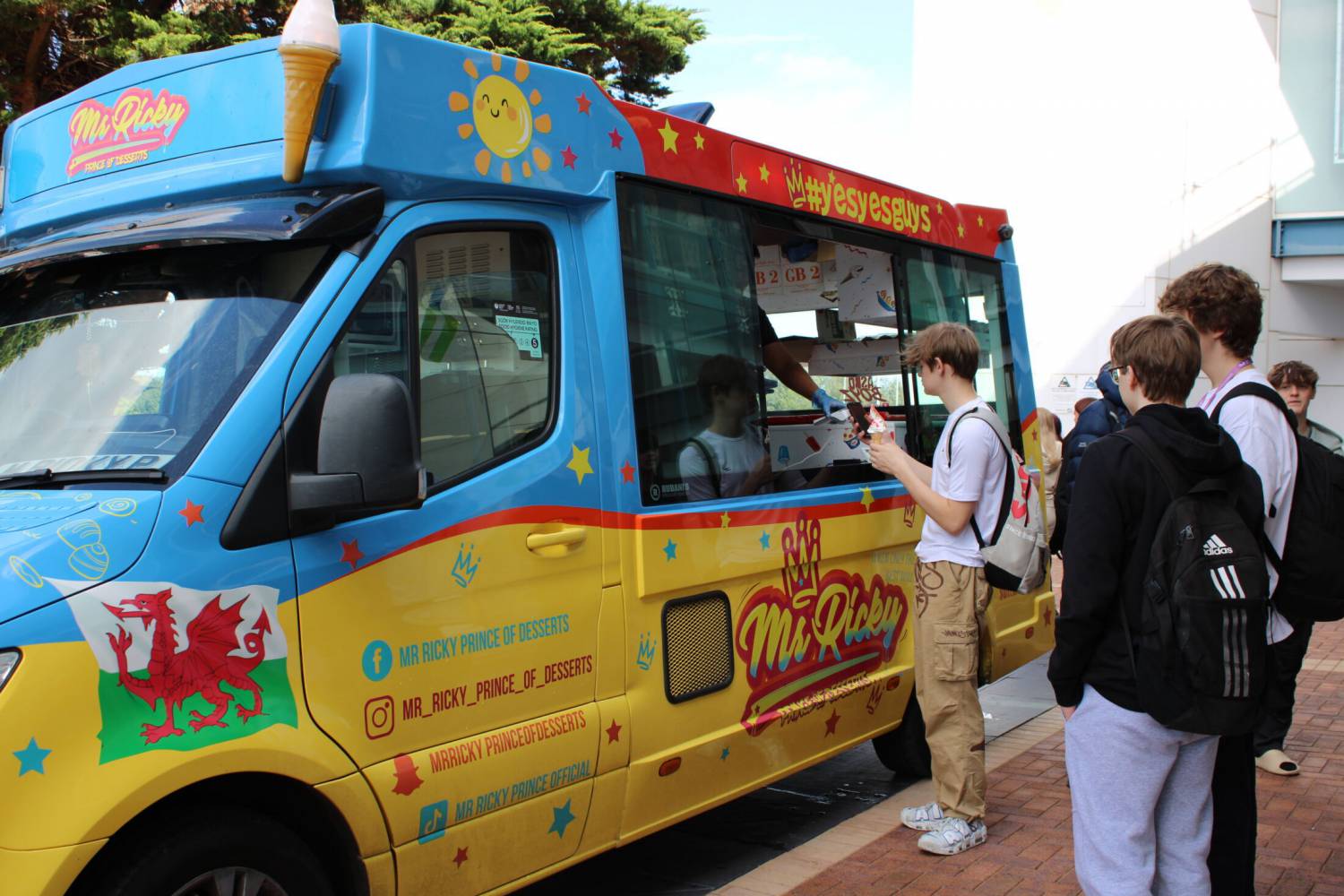 Students enjoying a Mr Ricky’s ice cream at the Coleg Llandrillo Rhos Freshers Fair