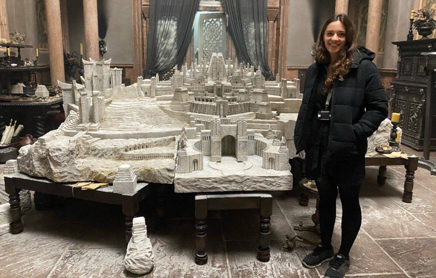 Former Coleg Menai student Beth Elen Roberts with the model of Old Valyria she helped design for House of the Dragon