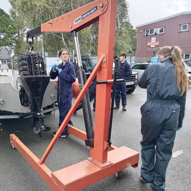 Heather Griffiths and Morgandie Harrold working on a boat at Coleg Meirion-Dwyfor’s Hafan campus in Pwllheli