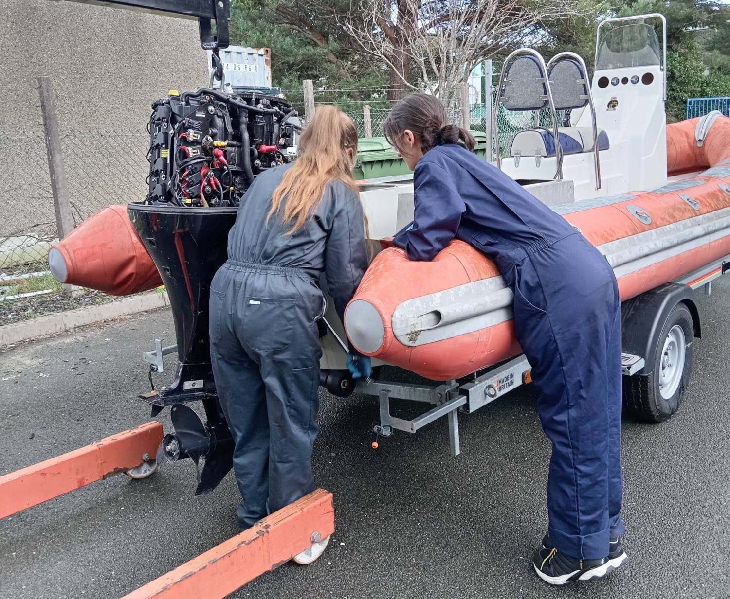 Heather Griffiths and Morgandie Harrold working on a boat at Coleg Meirion-Dwyfor’s Hafan campus in Pwllheli