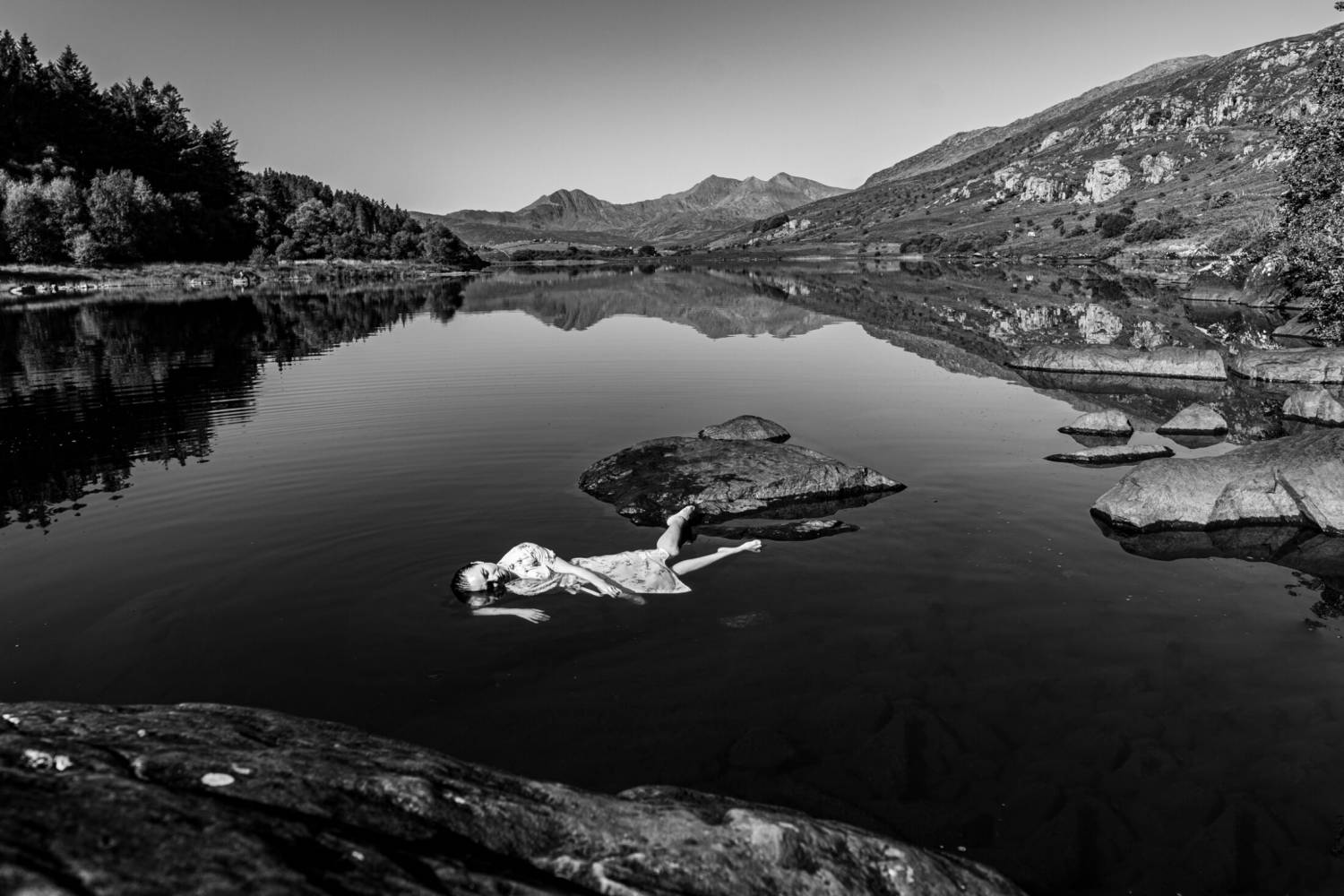Anthony J Harrison’s picture Immersed, which depicts Kseniia Fedorovykh resting on a rock in one of the Llynnau Mymbyr near Capel Curig