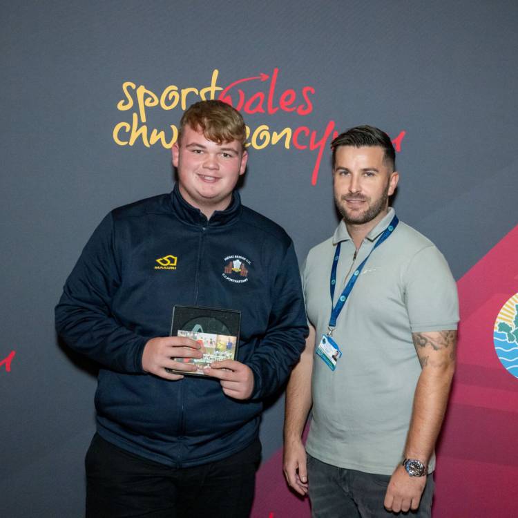 David Owen being presented with the Young Ambassador of the Year award at the Môn Actif Sports Awards 2023