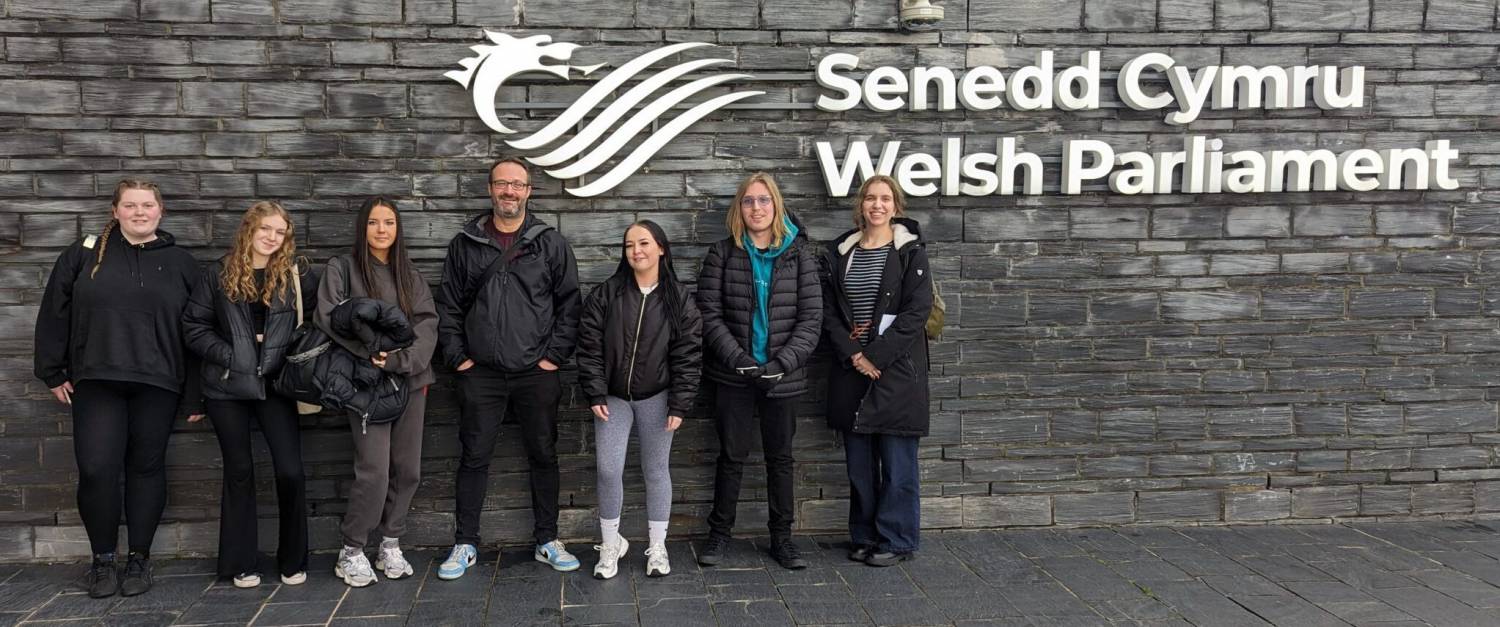 Coleg Llandrillo students with lecturer Peter Cornish outside the Senedd