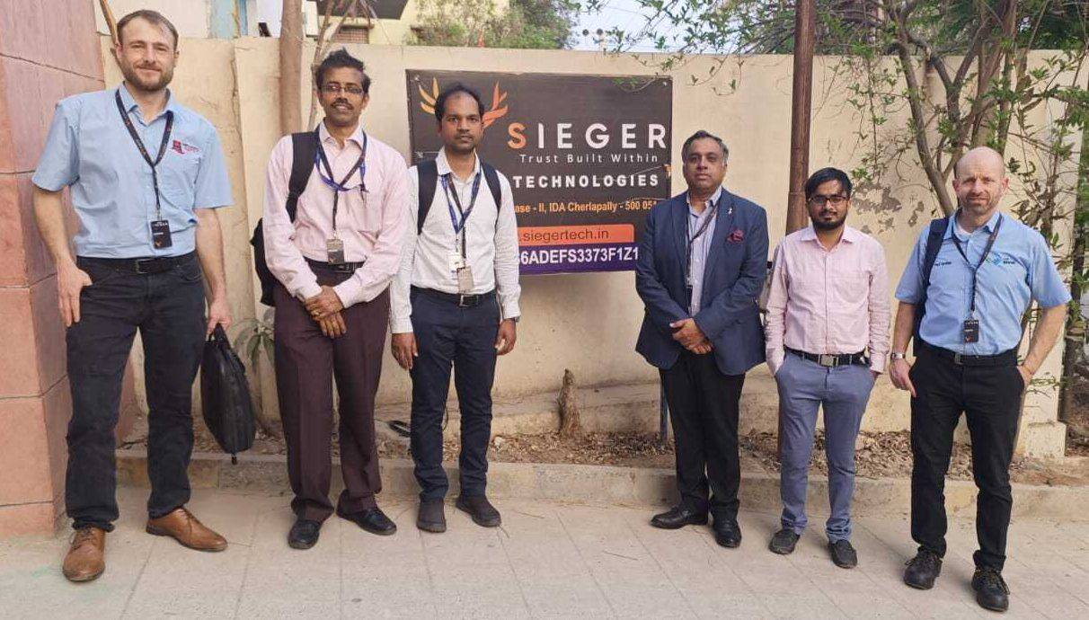 Coleg Llandrillo lecturer Paul Griffith and NPTC lecturer Will Davies with other delegates on their trip to India